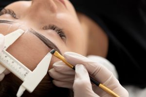 beautician working client s eyebrows 23 2149183836